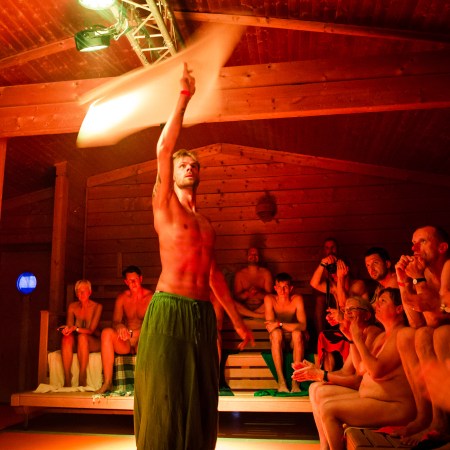 A "saunameister" performing aufguss in a sauna.