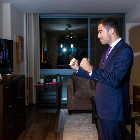 A photo of influencer Tony P. filming content in his apartment.