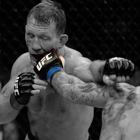 Gray Maynard, a former UFC fighter, getting punched in the face during a bout in 2014. Maynard is now automatically part of a class-action antitrust lawsuit against the UFC.