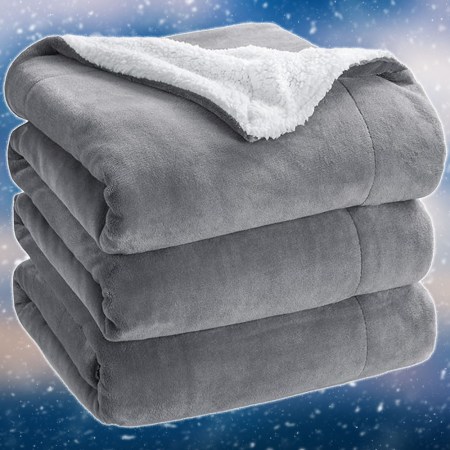 a grey Bedsure blanket on a snowy blue background