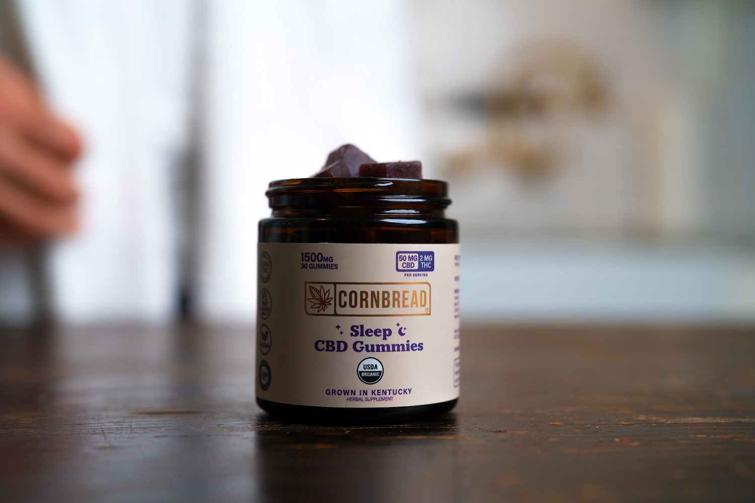 cornbread hemp cbd gummies sitting on a wooden table