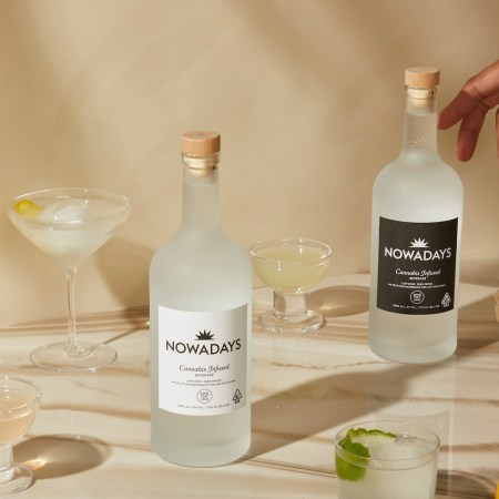 Bottles of Nowadays spirits with cocktails