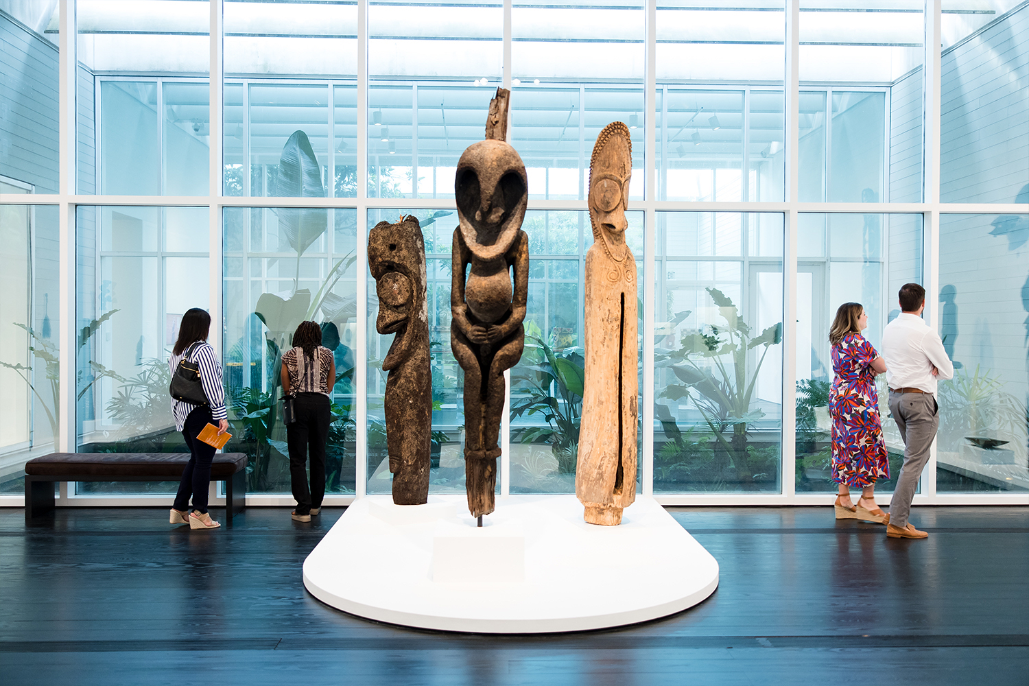 People walking by an exhibit in The Menil Collection