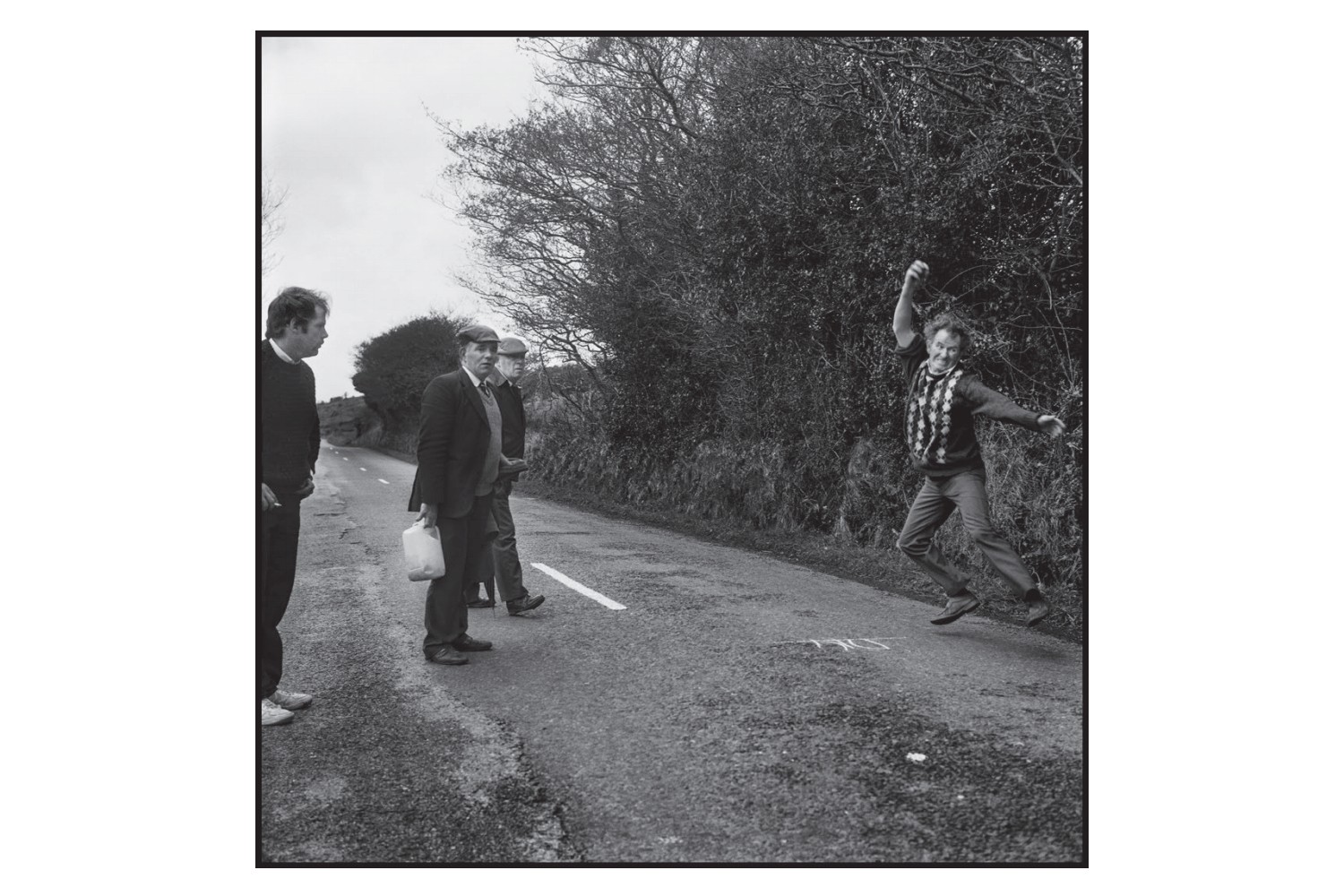 Men standing in the road