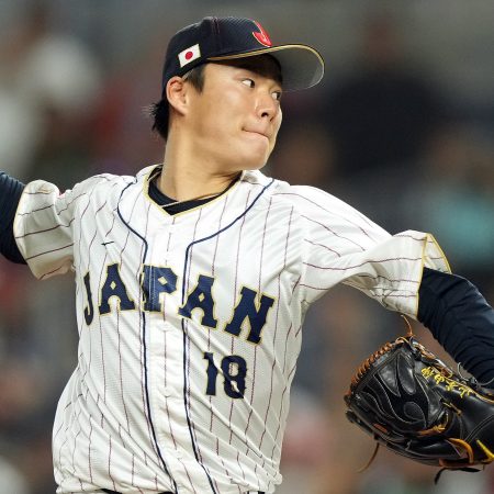 Yoshinobu Yamamoto pitches for Team Japan.