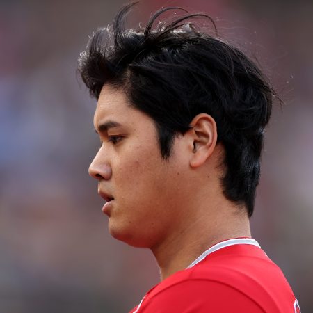 Shohei Ohtani walks back to the dugout.