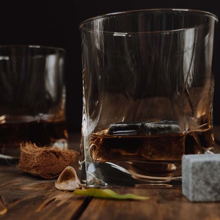 Two glasses of whisky with whisky stones, which are terrible for your drink