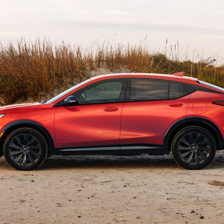 A red 2024 Buick Envista ST SUV sitting on the beach. It's one of our favorite affordable crossovers on the market.
