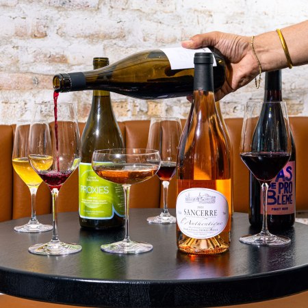 Glasses of wine and wine bottles