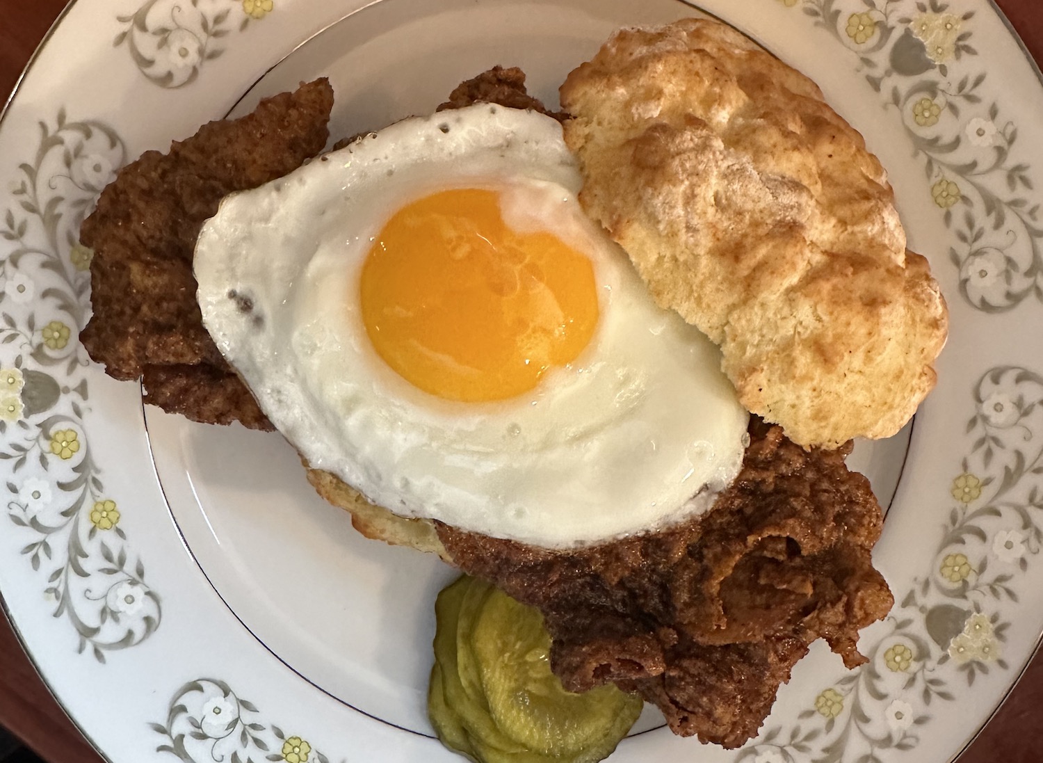 Egg and chicken and biscuit on a plate