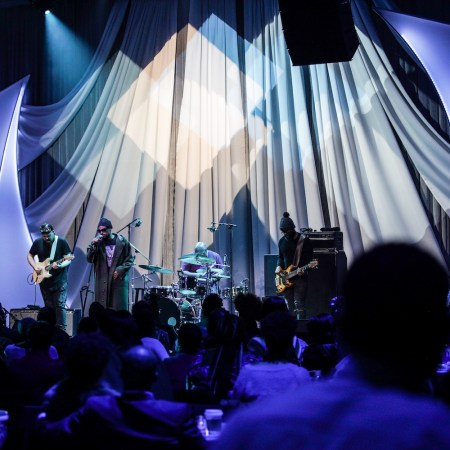 Band performing on stage in front of an audience