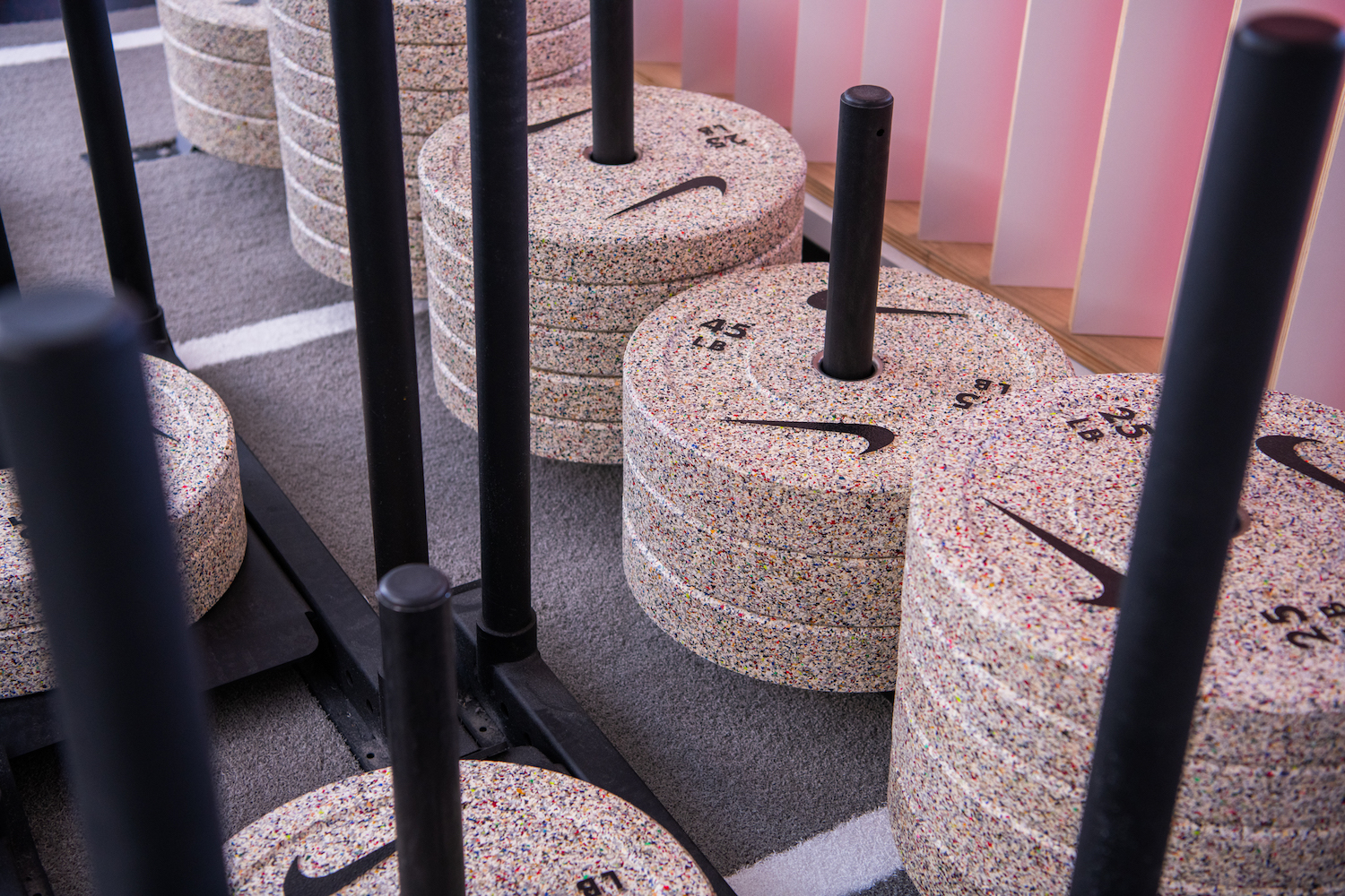 weight plates made from recycled shoes with the Nike symbol on them 