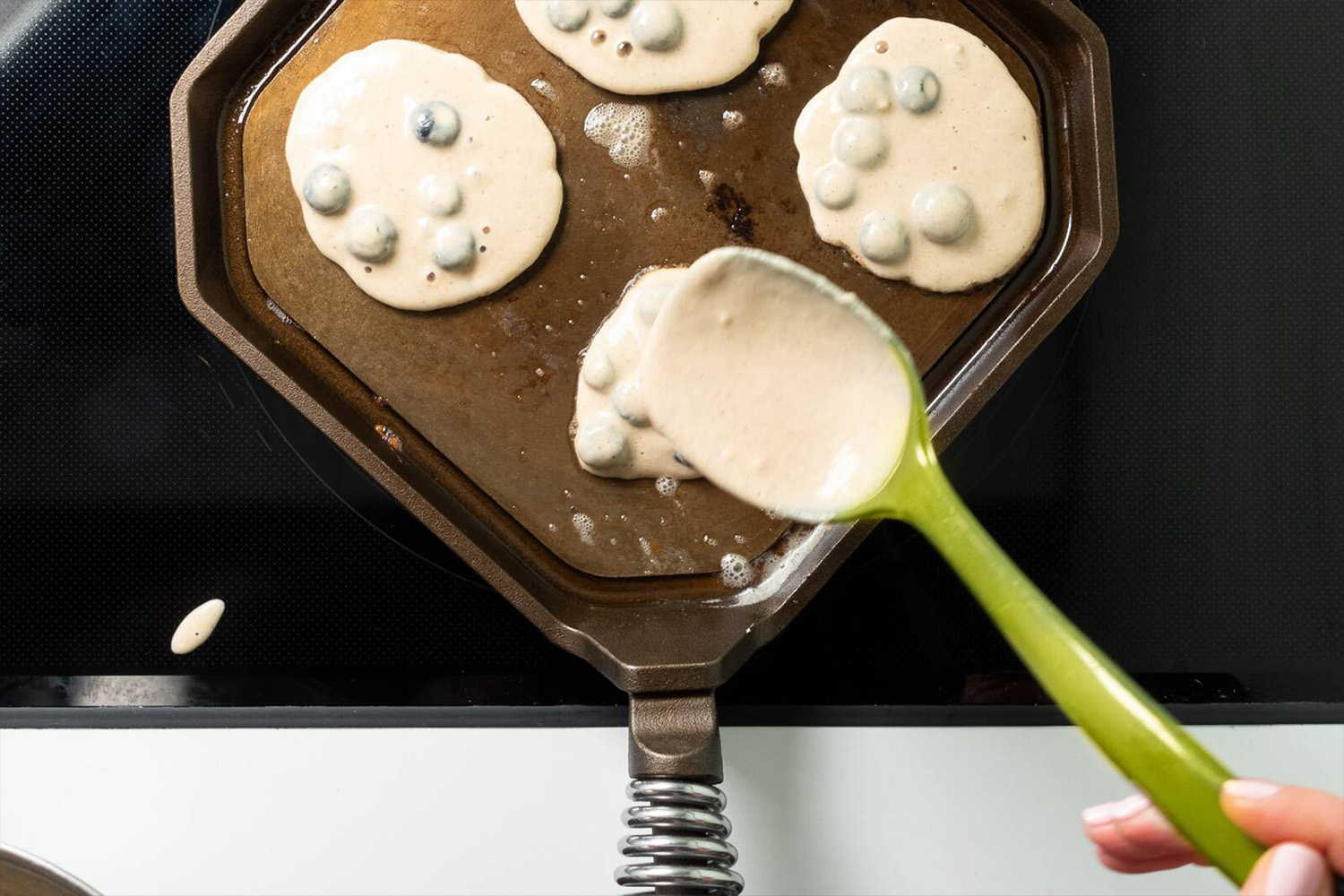 a FINEX griddle cooking pancakes