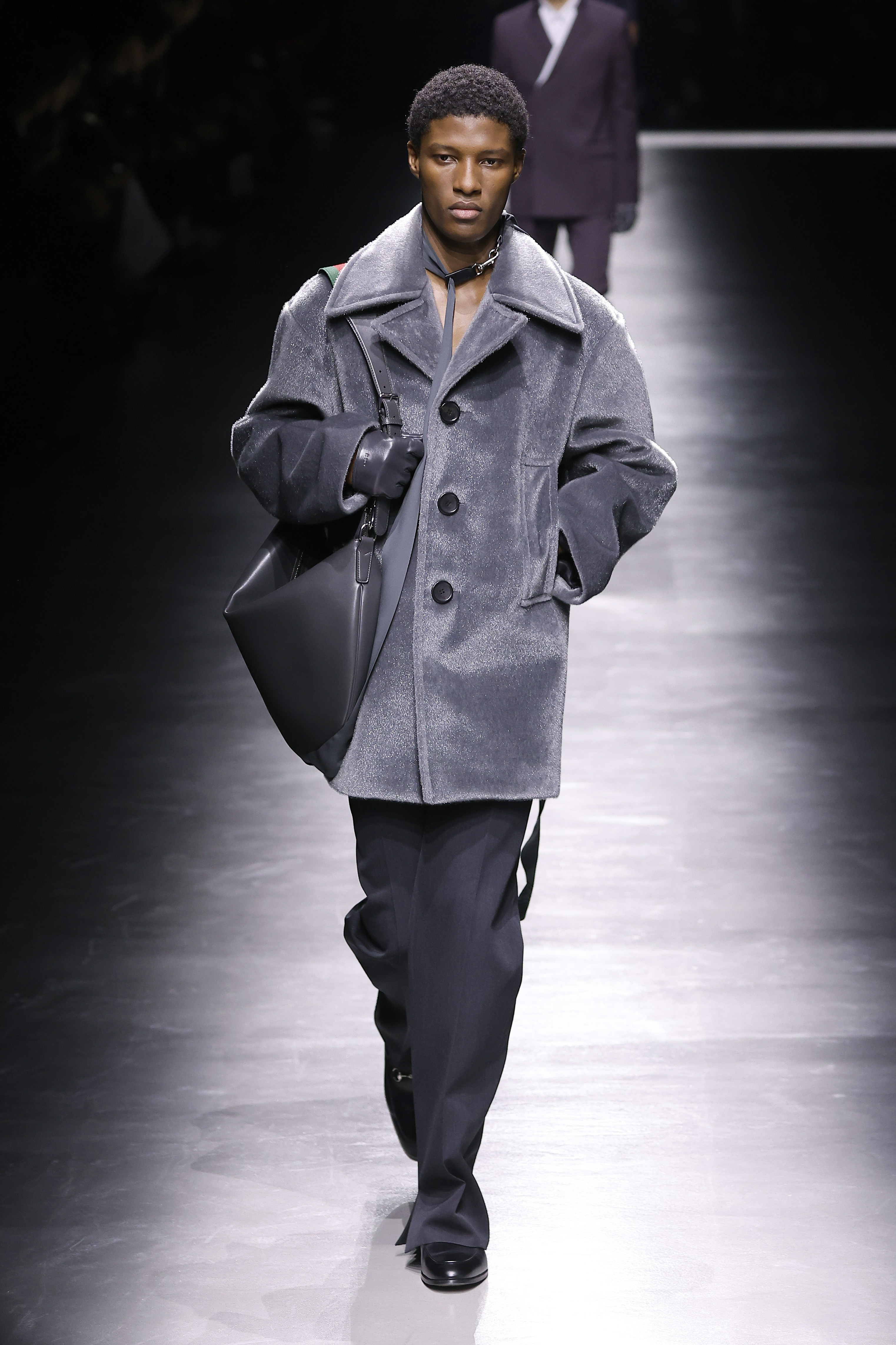 A model walks the runway at the Gucci fashion show during the Milan Menswear Fall/Winter 2024-2025