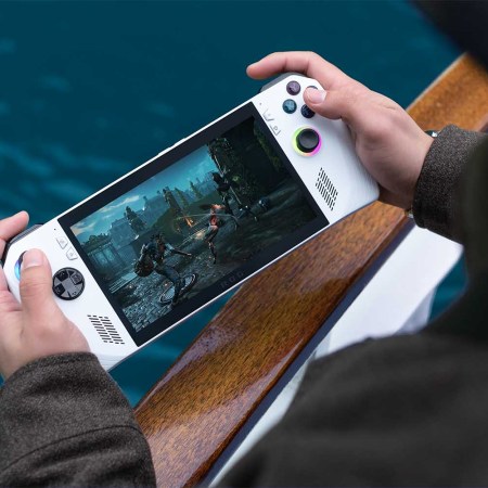 A person holding the portable Rog Ally gaming unit
