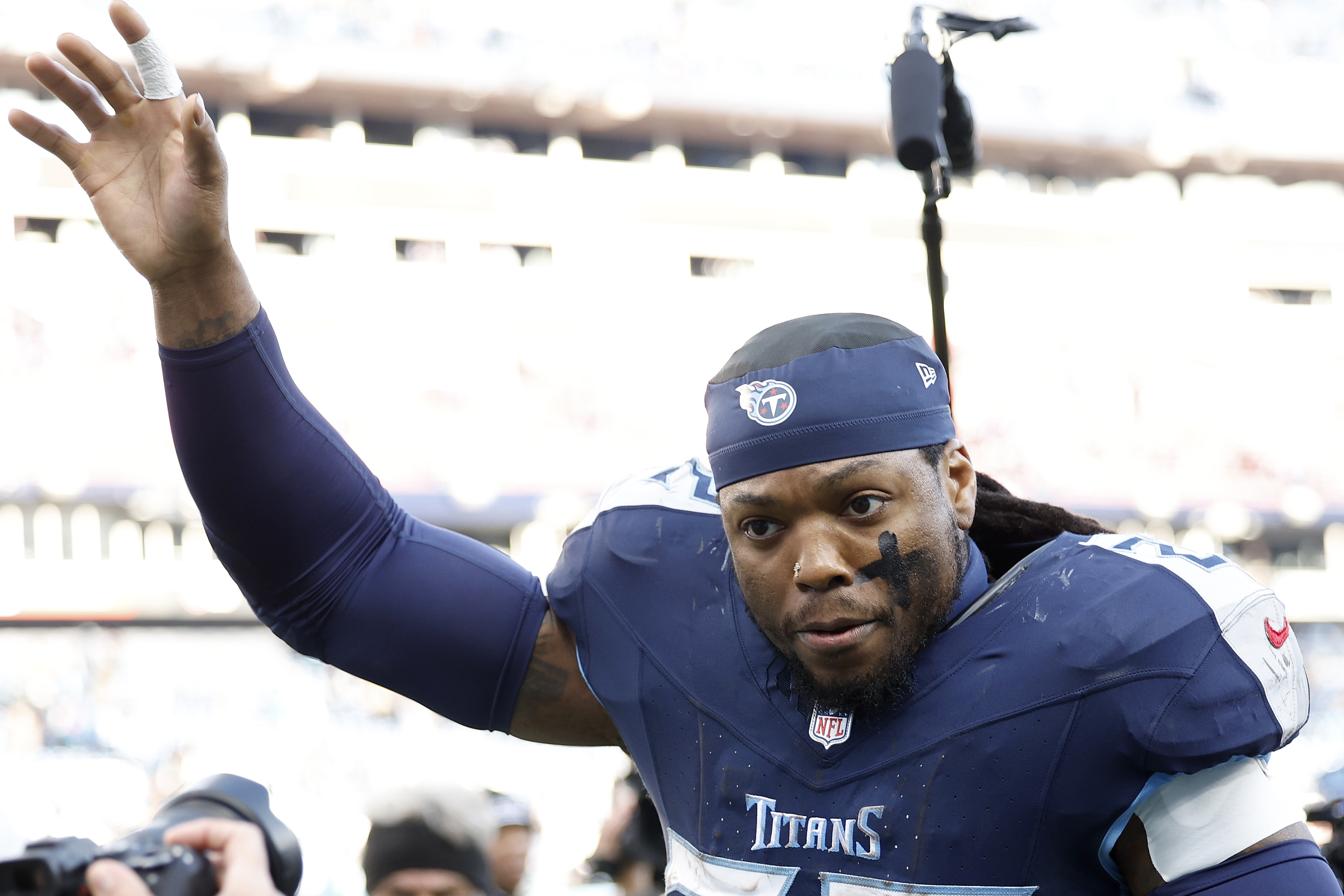 Derrick Henry of the Titans runs off the field.
