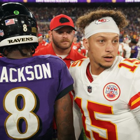 Lamar Jackson talks with Patrick Mahomes after a game.