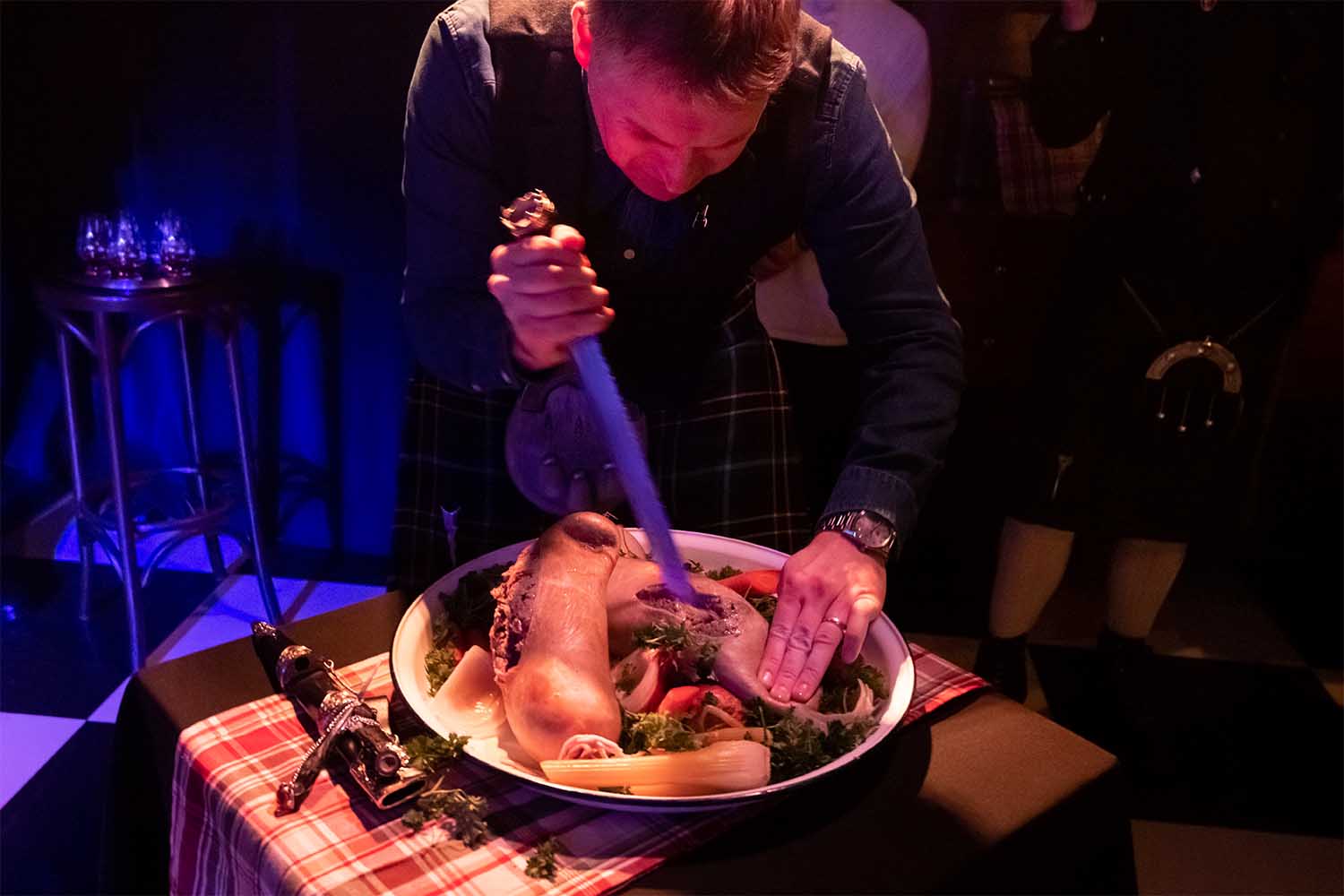 Andrew Weir cutting a haggis at Burns Distilled