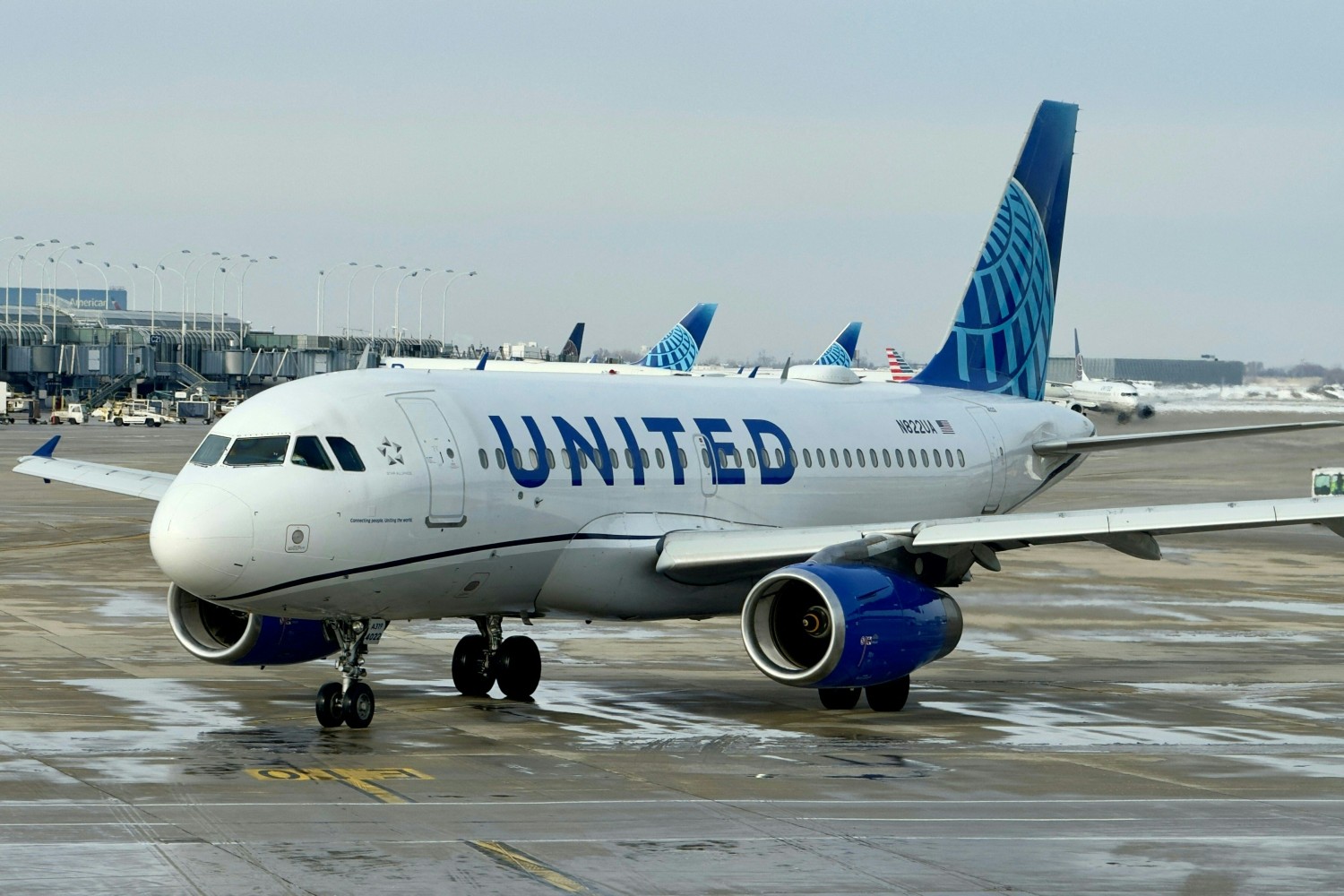 A United Airlines airplane taxiing at an airport. Here's how United and American Airlines are joining in on Taylor Swift-Super Bowl ever.
