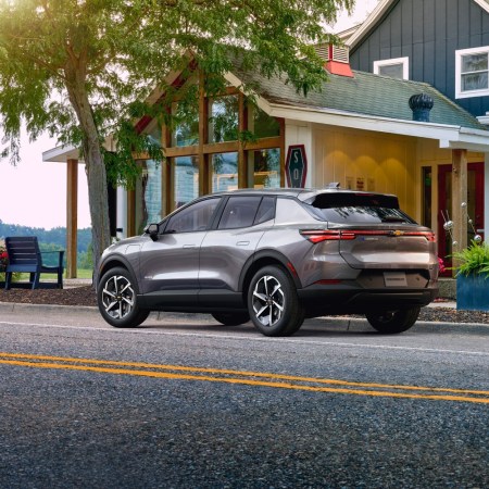 Chevrolet Equinox parked in a neighborhood. The Equinox is a relatively affordable EV.