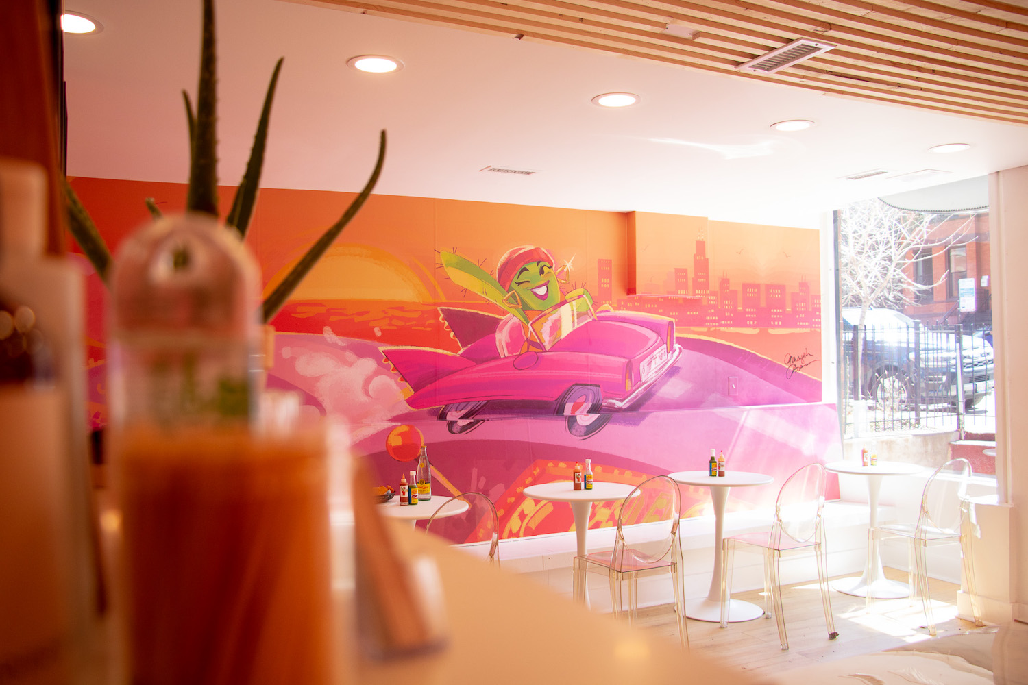 Poster on a wall in front of tables in a dining area