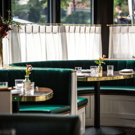 Green booth seats in Ellington Park Bistro