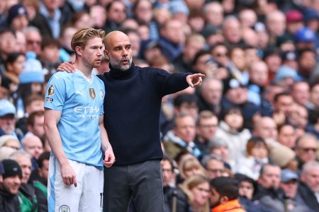 MANCHESTER, ENGLAND - FEBRUARY 10: Kevin De Bruyne and Pep Guardiola the head coach / manager of Manchester City during the Premier League match between Manchester City and Everton FC at Etihad Stadium on February 10, 2024 in Manchester, England. (Photo by Robbie Jay Barratt - AMA/Getty Images)