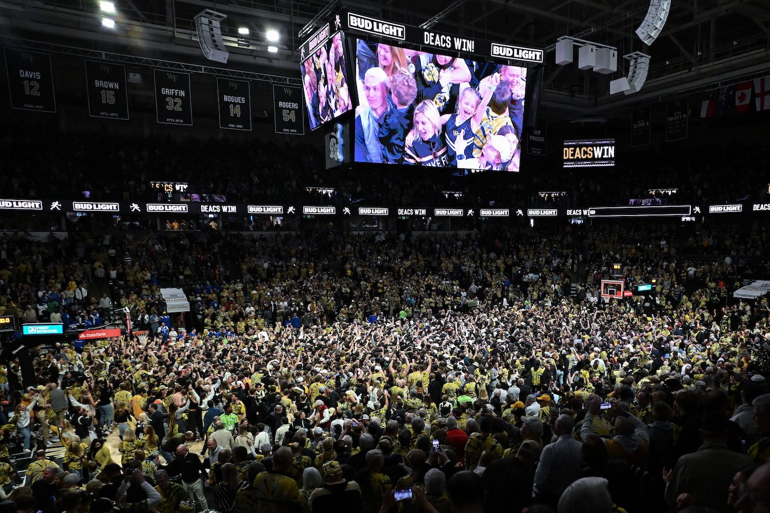 WINSTON SALEM, NORTH CAROLINA - FEBRUARY 24: Wake Forest Demon Deacons fans storm the court after a win Duke Blue Devils at Lawrence Joel Veterans Memorial Coliseum on February 24, 2024 in Winston Salem, North Carolina. Wake Forest won 83-79. (Photo by Grant Halverson/Getty Images)