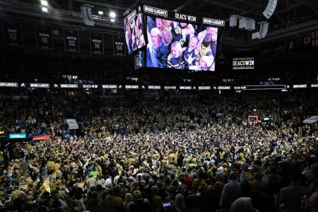 WINSTON SALEM, NORTH CAROLINA - FEBRUARY 24: Wake Forest Demon Deacons fans storm the court after a win Duke Blue Devils at Lawrence Joel Veterans Memorial Coliseum on February 24, 2024 in Winston Salem, North Carolina. Wake Forest won 83-79. (Photo by Grant Halverson/Getty Images)