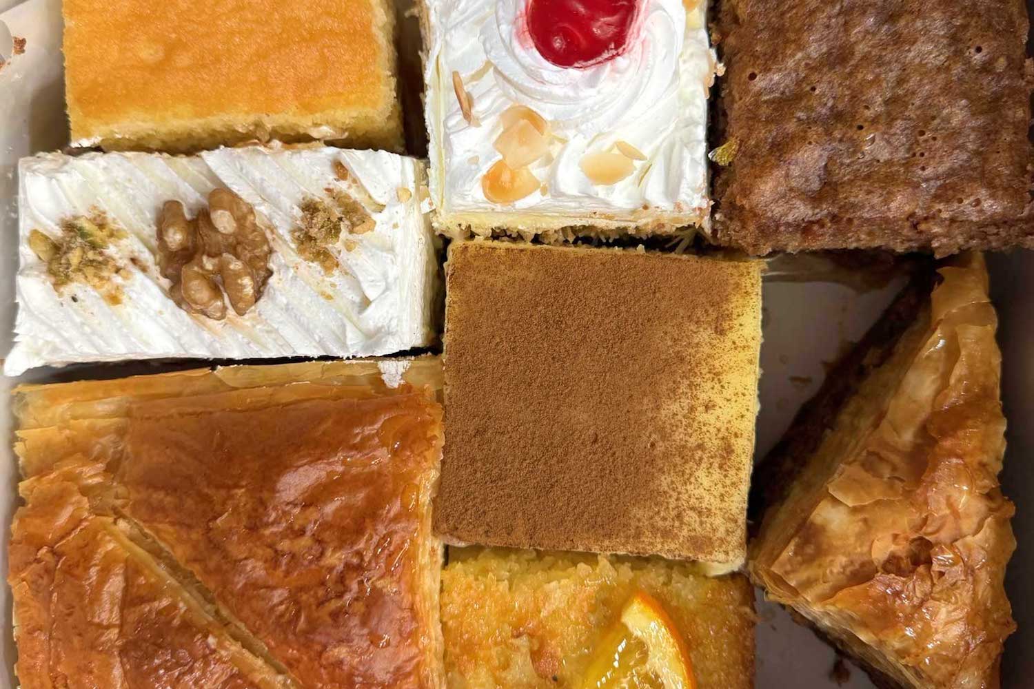 A box of traditional Greek pastries at Victory Sweet Shop