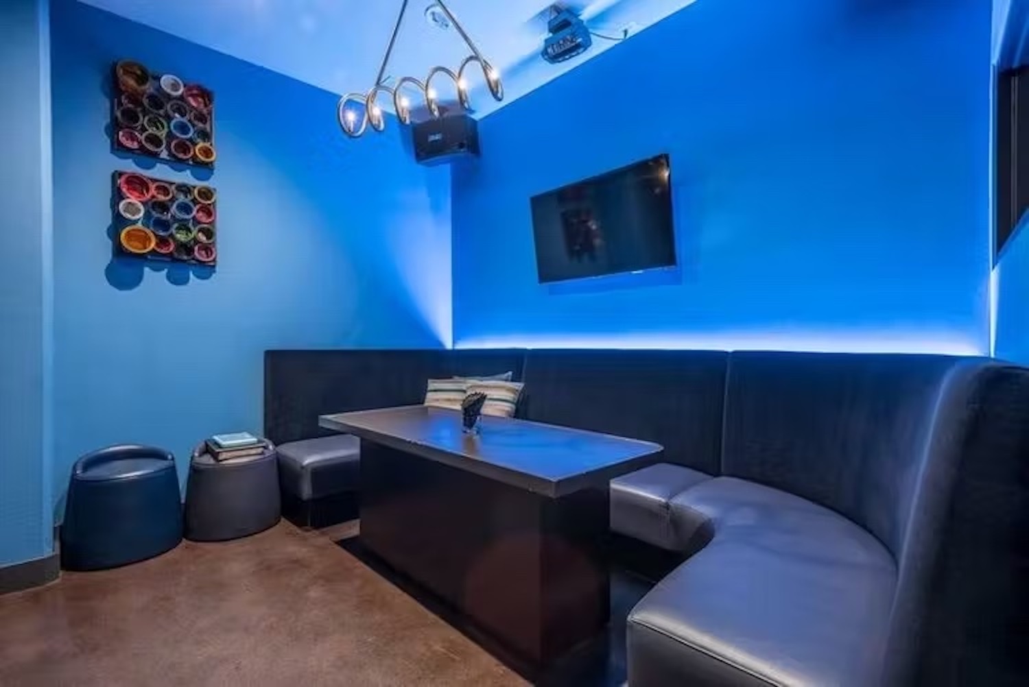 Interior of The Venue with a booth seat and blue lighting
