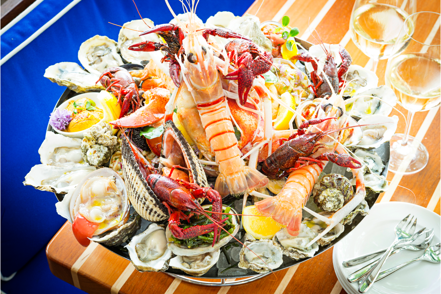 seafood, lobster, shrimp, clams, oysters, lemon, garnish, wine glass