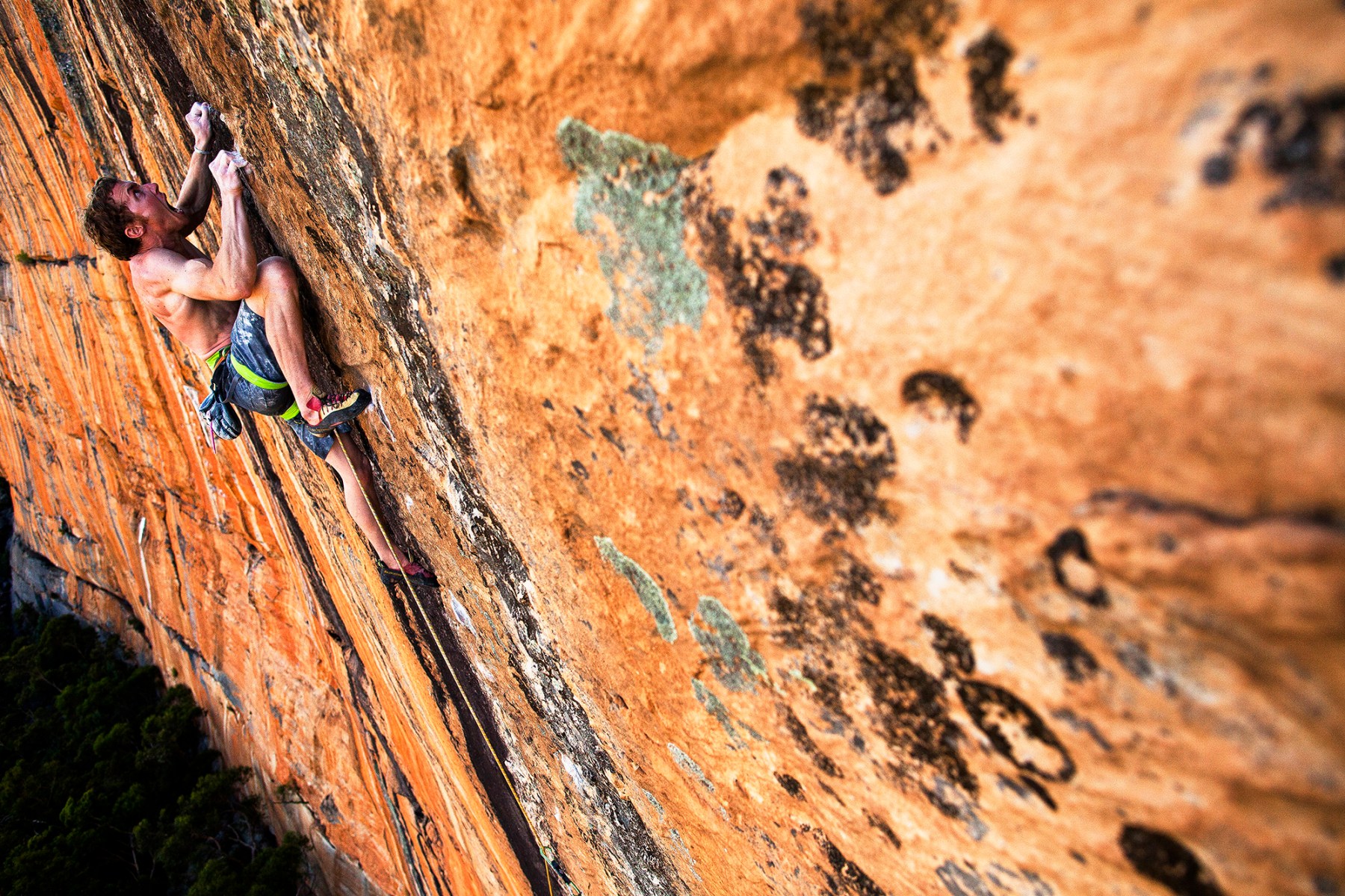 This is Ben Cossey, an Aussie climber. This is from the beginning of my career and it's at a place called Taipan Wall in Australia. It was so hot that day that it was not an ideal climbing temperature. It forced Ben to climb even harder. He was fighting the sweat and hanging on to these tiny, tiny clamps. The emotion on his face is definitely the real deal. He was screaming to get through those moves.