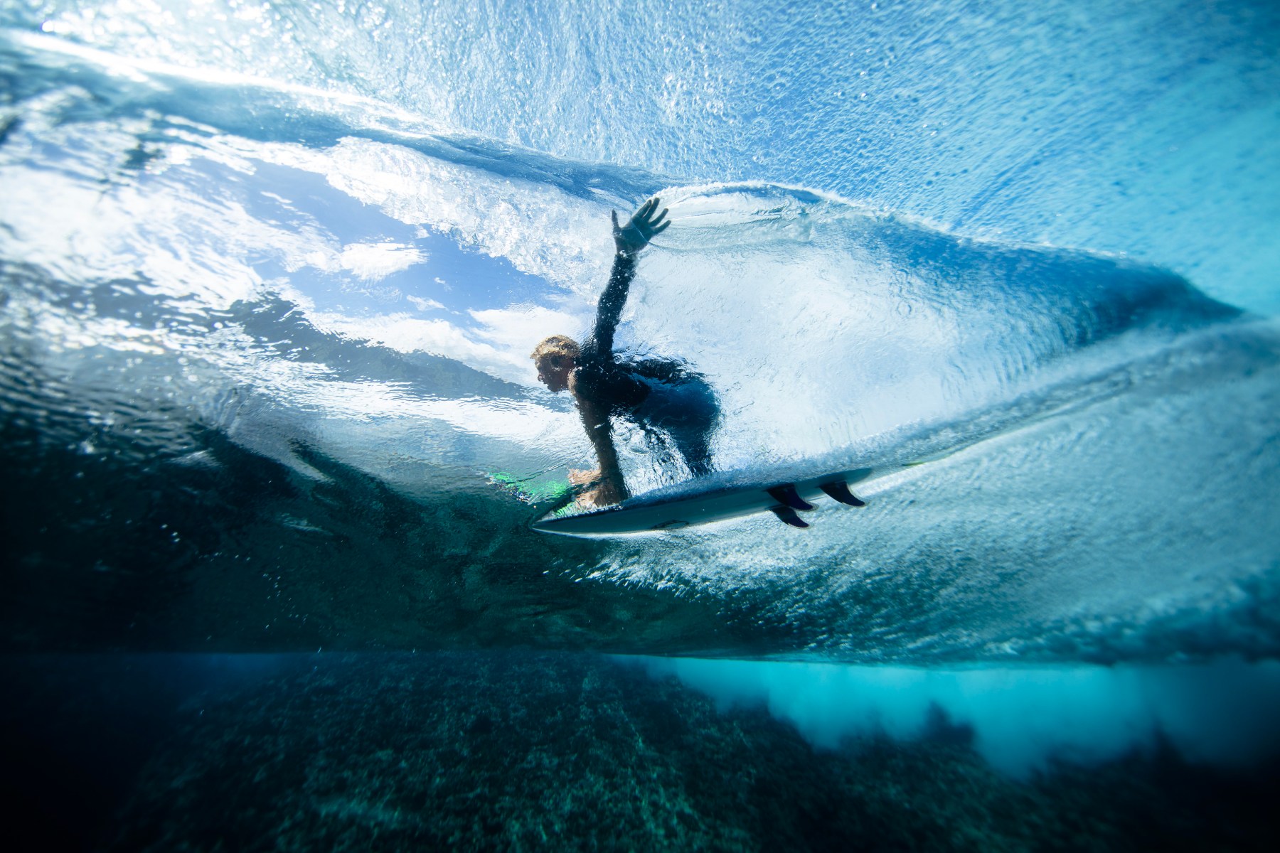 This photo is from Teahupo'o in French Polynesia. We've seen this image time and time again, but as a photographer t wanted to experience it for myself. Luckily, I scored a swell where it was like eight to 10 feet that day, It’s definitely a thrill.  If you get caught out in the wrong spot in the surf, you will get pummeled by the waves and potentially dragged over the reefs