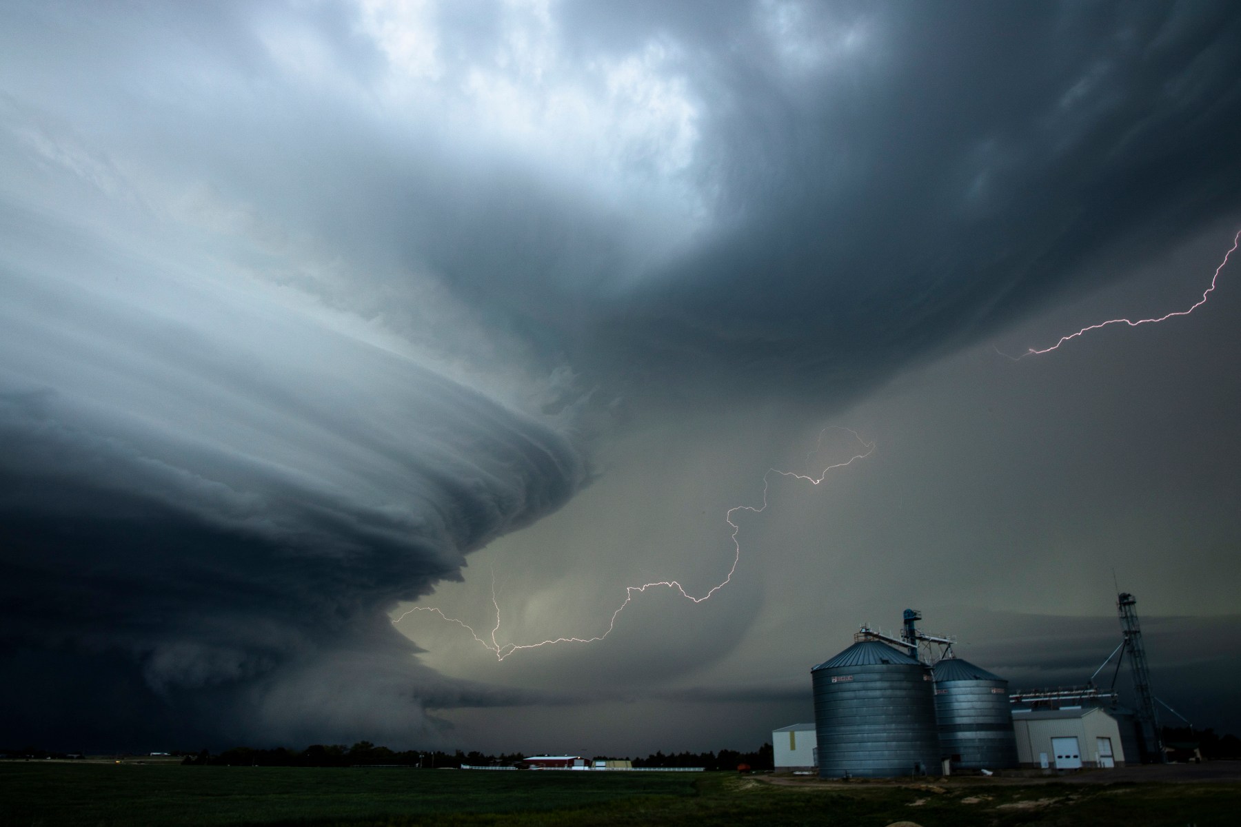 This is what you call a mothership. When you get into storm-chasing terminology, it's hilarious. Earlier in the day, we had seen a tornado but there was so much moisture in the air that it just disappeared into the rain. At some point, we abandoned that chase. If you can't see it, don't chase it. That storm was so powerful, the outflow boundary turned into a supercell and that’s how the mothership forms. It takes on a bit of a UFO shape. That structure is absolutely phenomenal to witness.