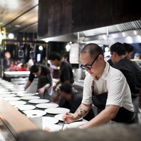 Chef Jeremiah Stone cooking at the Impression Makers Supper Club Series