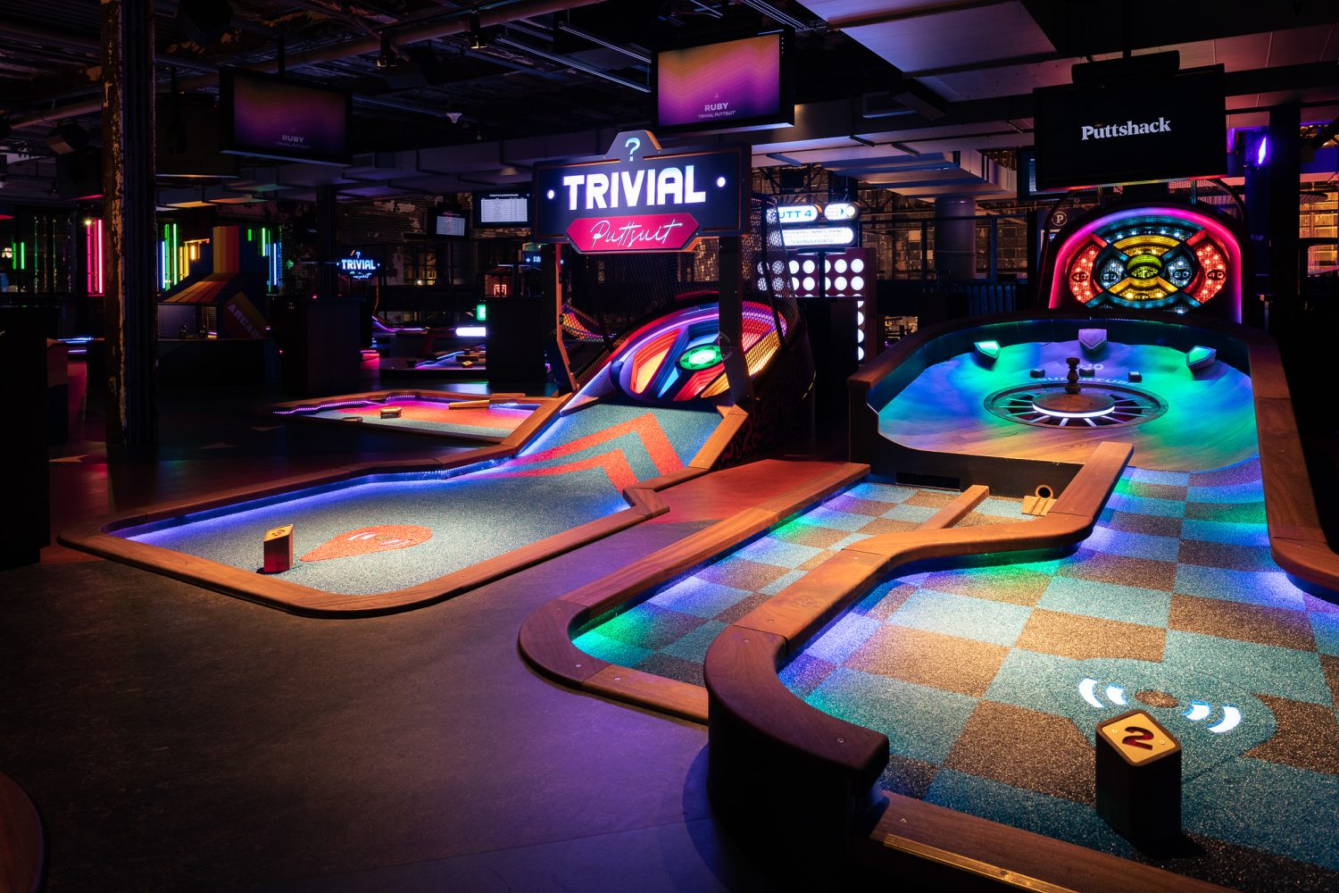 dark basement, neon lights, games, signs