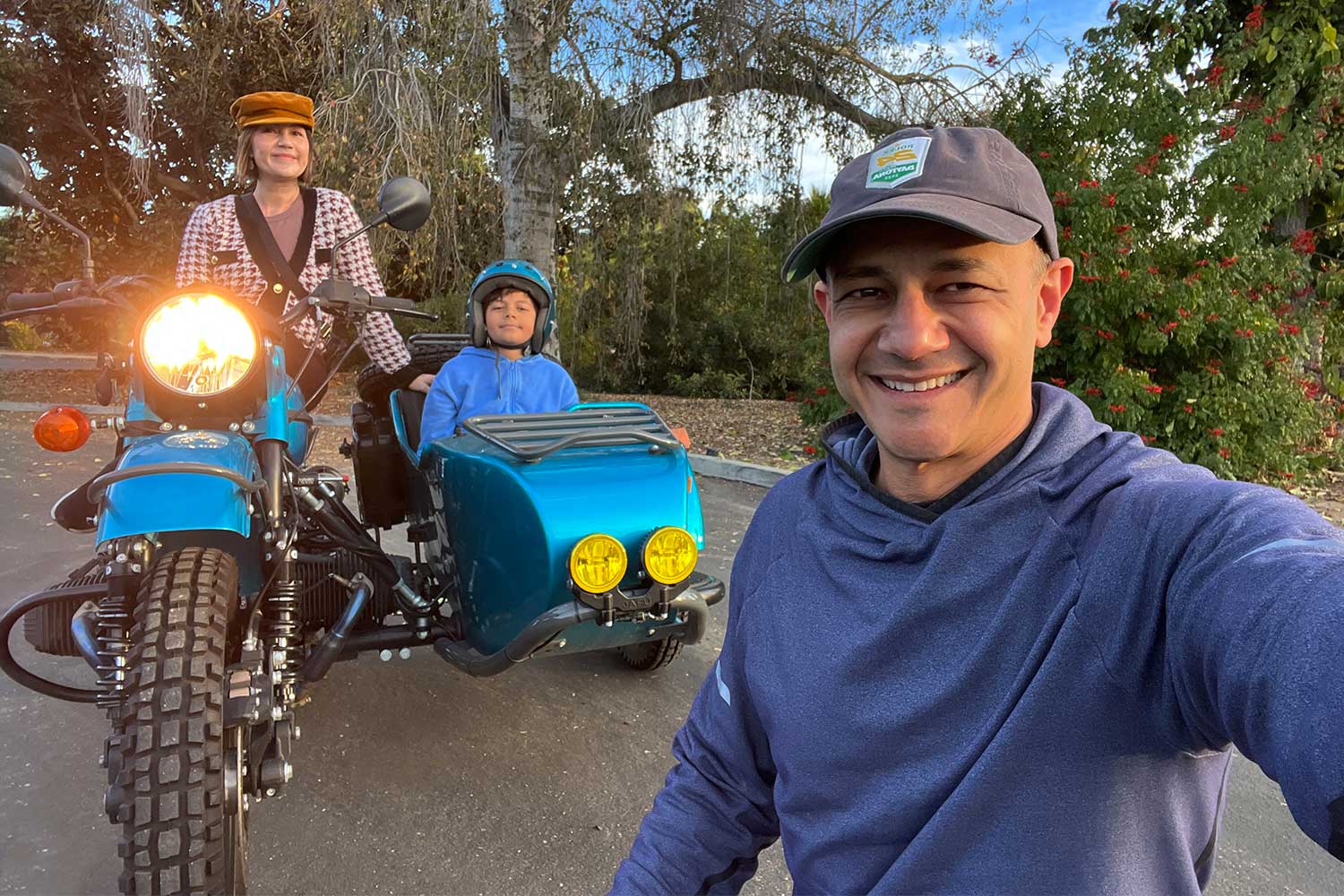 A family getting ready to ride in the Ural Gear Up sidecar motorcycle