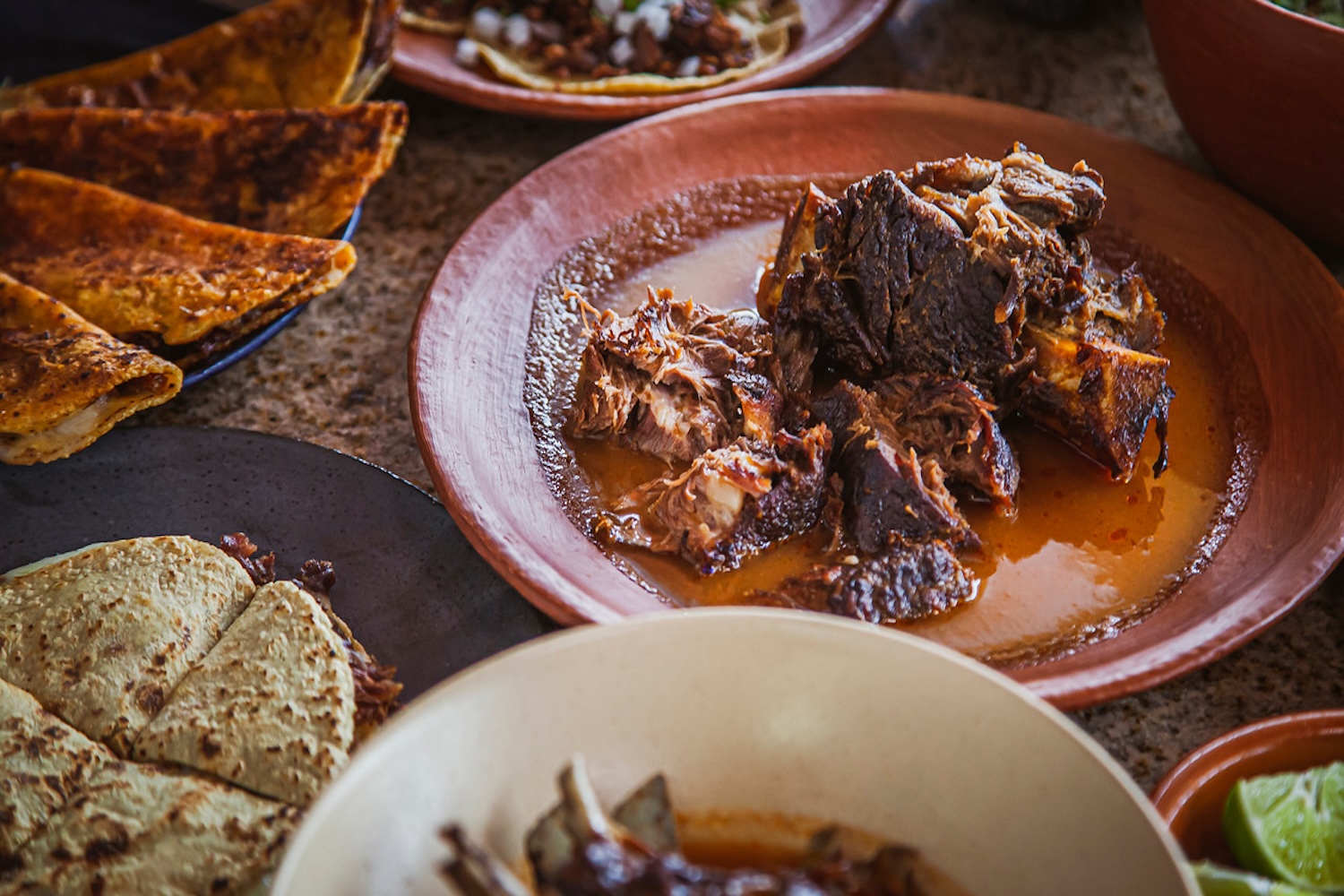 plate of beef, two plates of quesadillas 