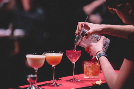 A typical Speed Rack bartending competition set up with three cocktails