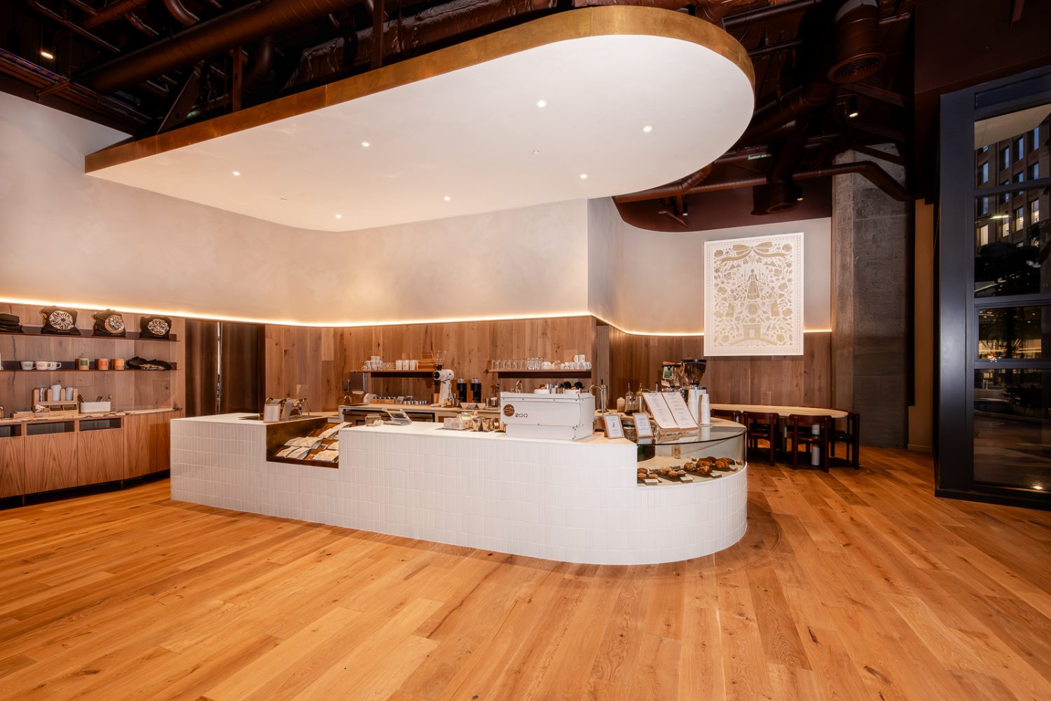 white block with cashier, painting, wooden floors