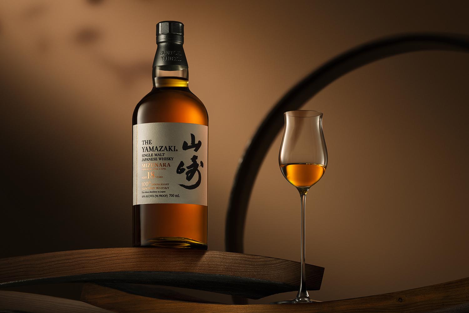 A bottle and glass of Yamazaki 18 Year Old Mizunara