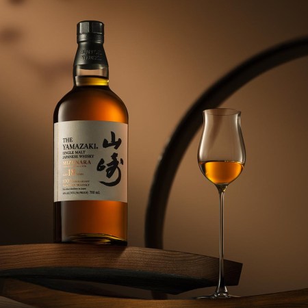A bottle and glass of Yamazaki 18 Year Old Mizunara