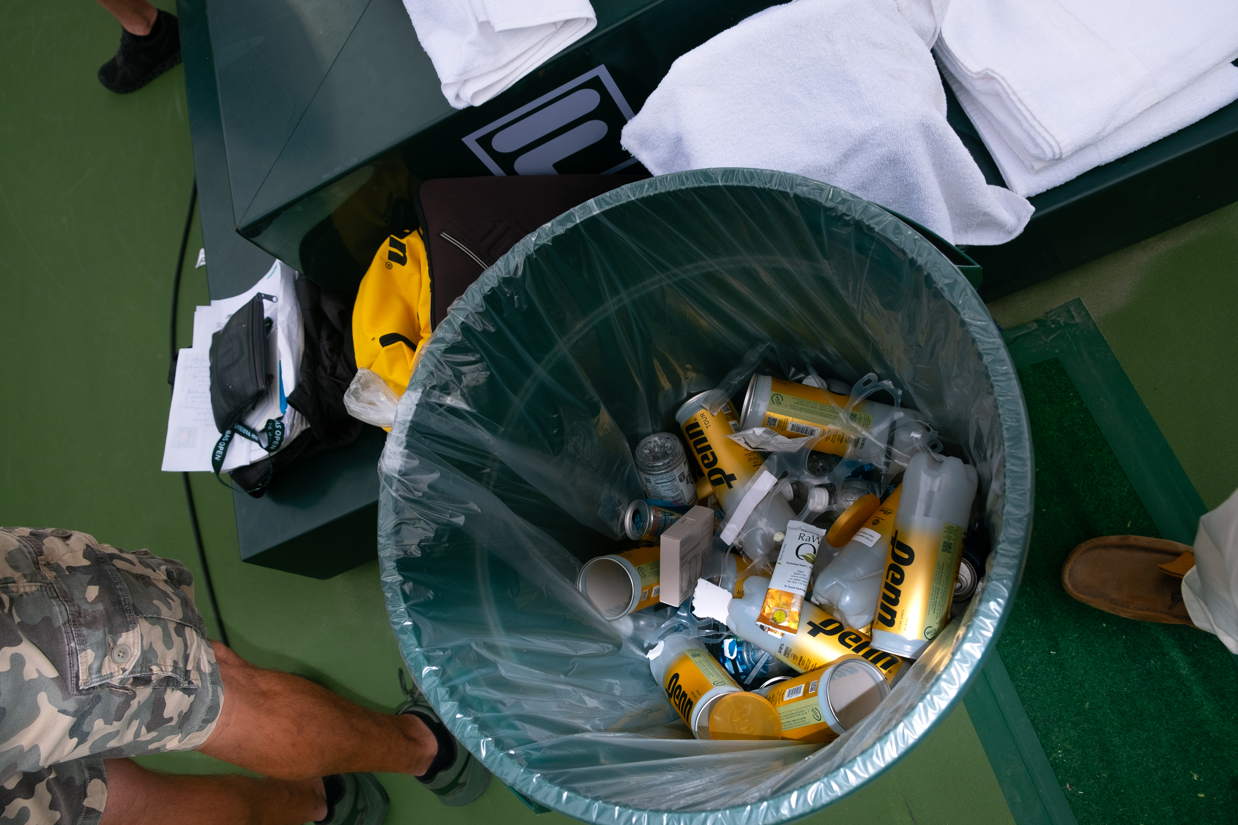A trash bin of crushed tennis cans.