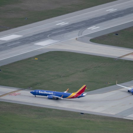 Southwest Airlines airplanes on the runway. A plane manufactured by Boeing had its engine cover rip off during takeoff.