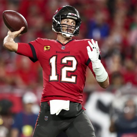 Tom Brady throwing a pass for the Tampa Bay Buccaneers.
