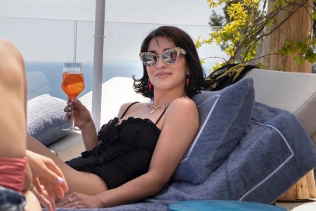 lucia from white lotus drinking an aperol spritz