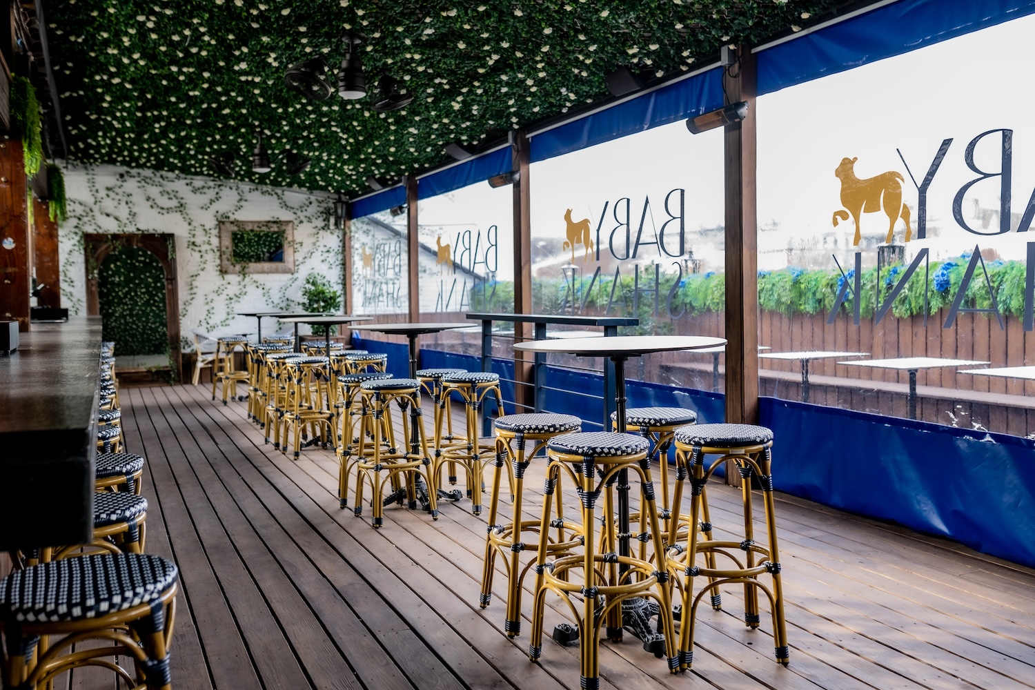 stools and round tables, faux grass ceiling with lights