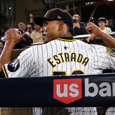 Jeremiah Estrada of the Padres celebrates after striking out the Marlins.