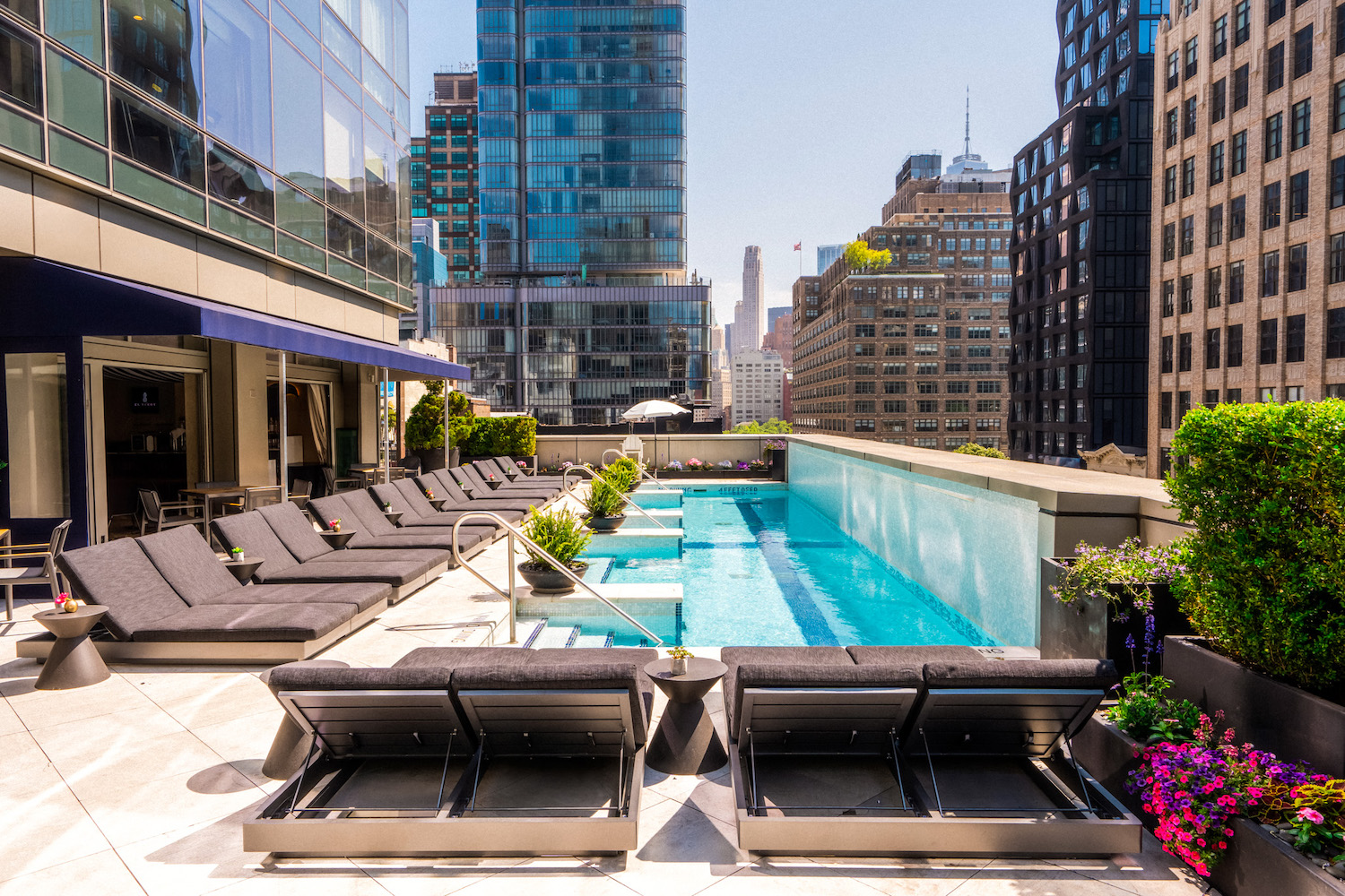 The Terrace's "oasis," featuring lounge chairs, cocktails, and limitless skyline